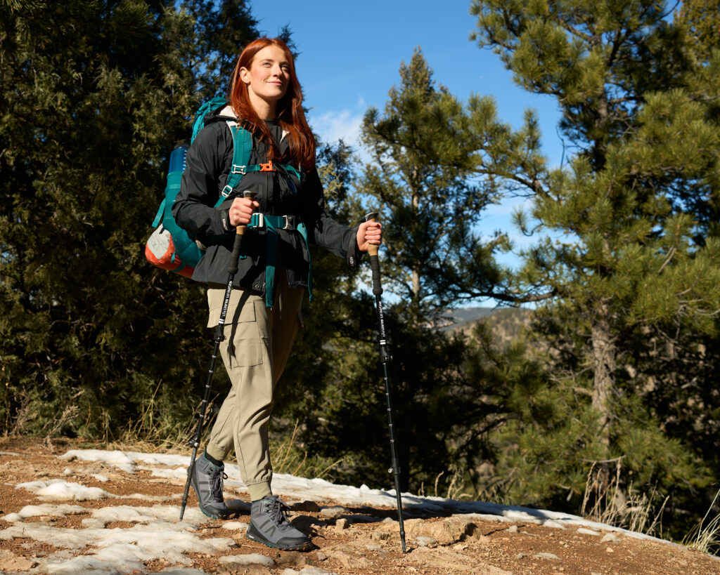 A woman taking in the views while on a hike in her Scrambler Mid II WP boots