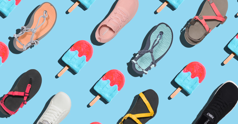 Various Xero Shoes and Sandals arranged next to red and blue popsicles